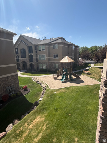 909 South Main Street, Unit F Layton, UT 84041 - Photo 16 of 20 Community playground featuring a slide and sand area