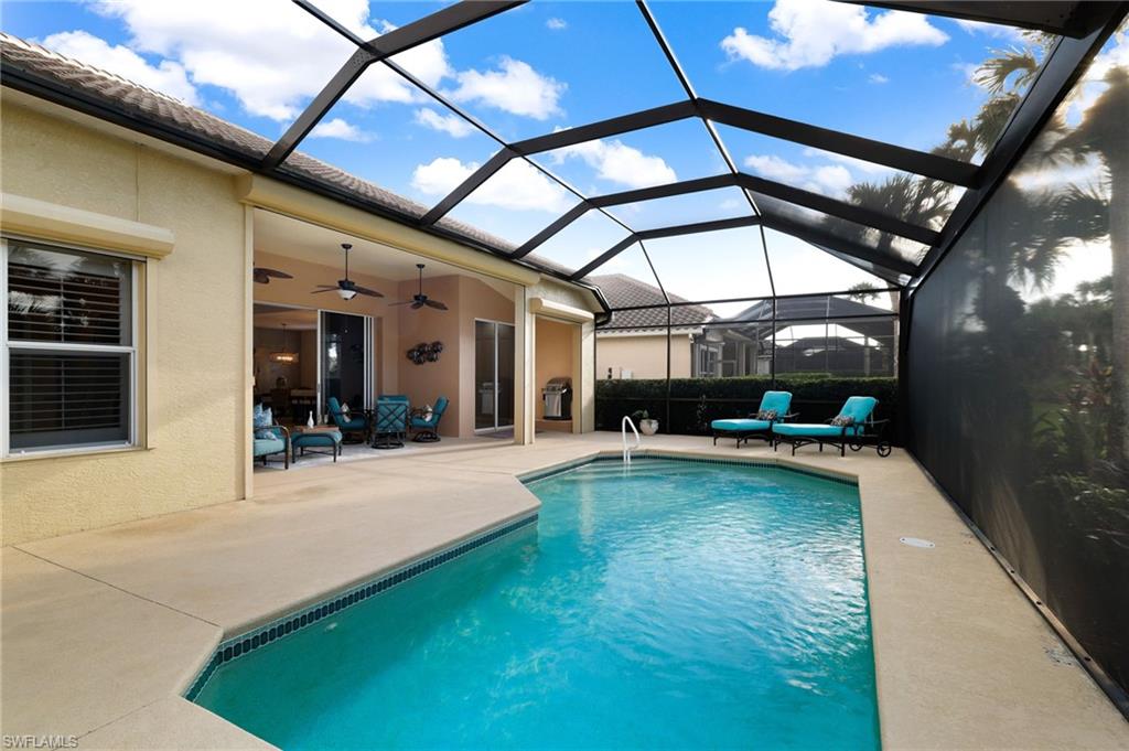 10071 St Moritz Drive Miromar Lakes, FL 33913 - Photo 23 of 45 a view of swimming pool with outdoor seating