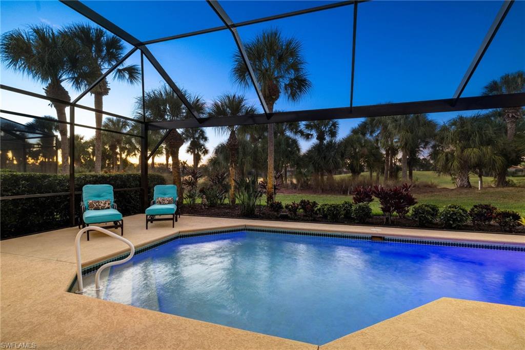 10071 St Moritz Drive Miromar Lakes, FL 33913 - Photo 24 of 45 a view of a swimming pool with a patio