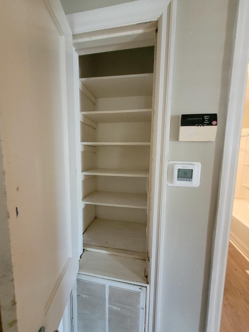 2309 East Main Street Durham, NC 27703 - Photo 22 of 30 a view of walk in closet with empty racks