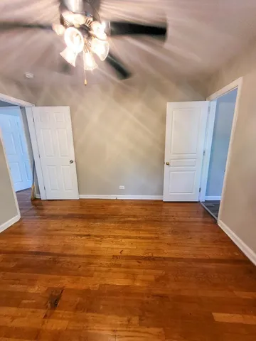 a view of front door with wooden floor
