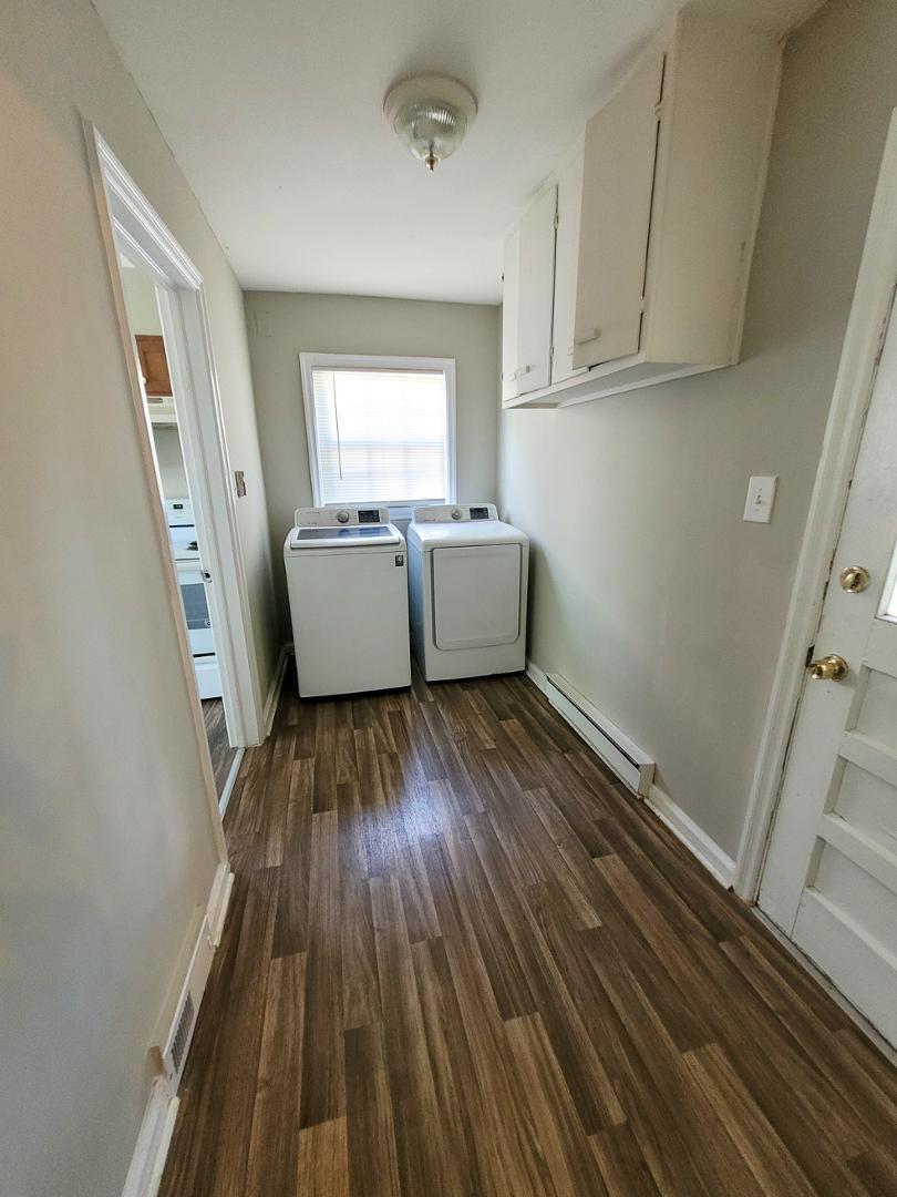 2309 East Main Street Durham, NC 27703 - Photo 28 of 30 a room with wooden floors and window