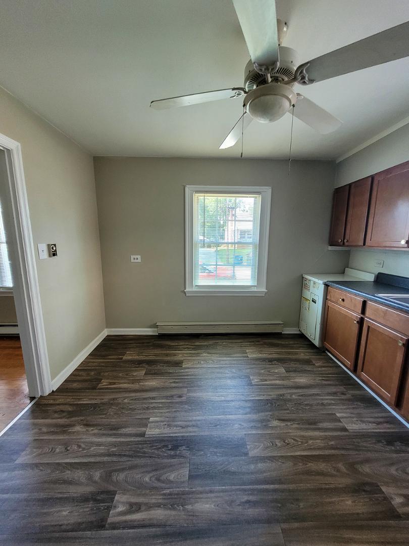 2309 East Main Street Durham, NC 27703 - Photo 7 of 30 a view of an empty room with window and wooden floor