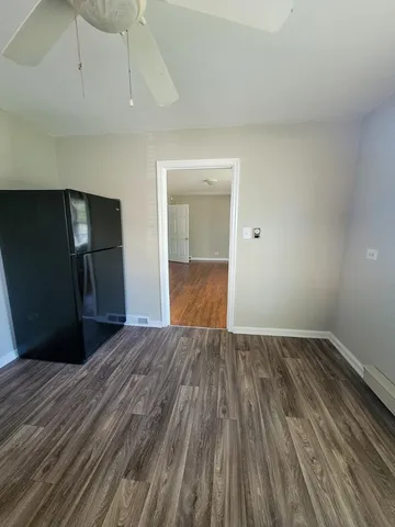 a view of a livingroom with wooden floor
