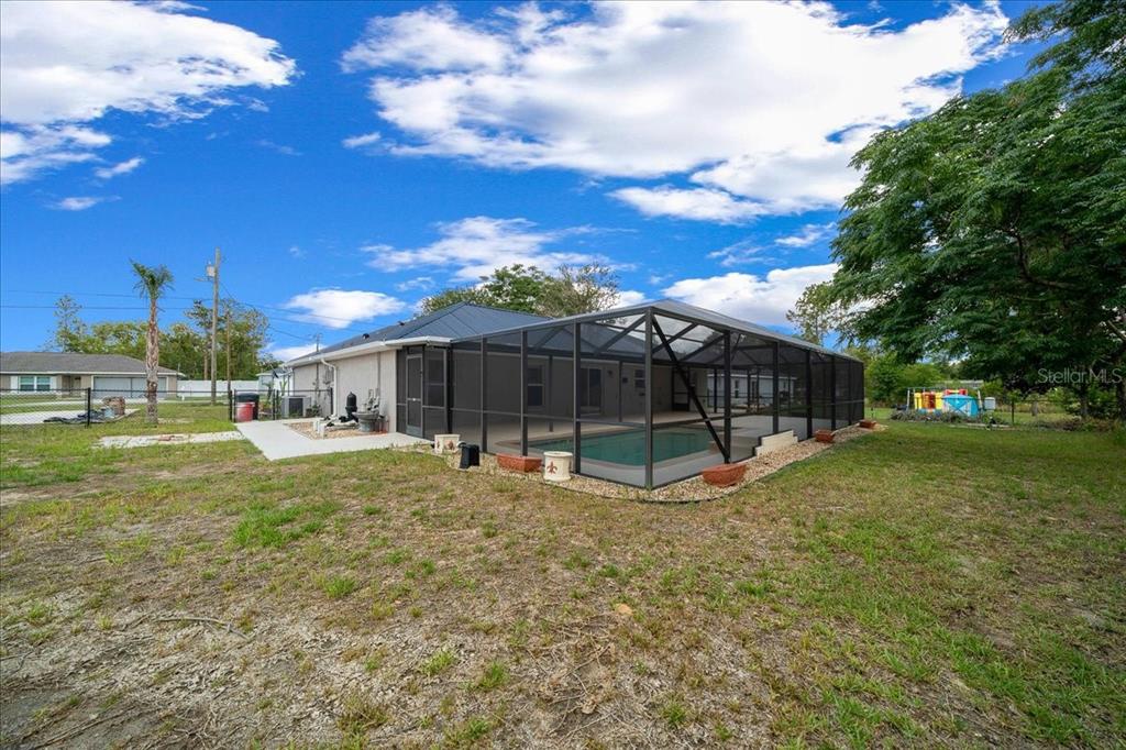 234 Locust Lane Ocala, FL 34472 - Photo 22 of 71 a view of a house with backyard and sitting area