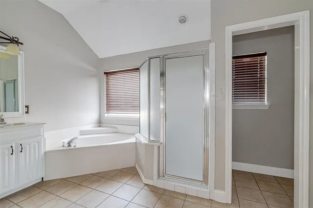 a bathroom with a bathtub and a sink