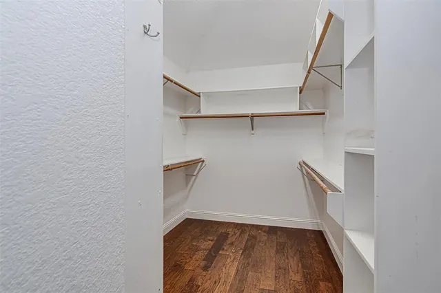 a view of an empty walk in closet