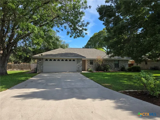 a large white house with a yard
