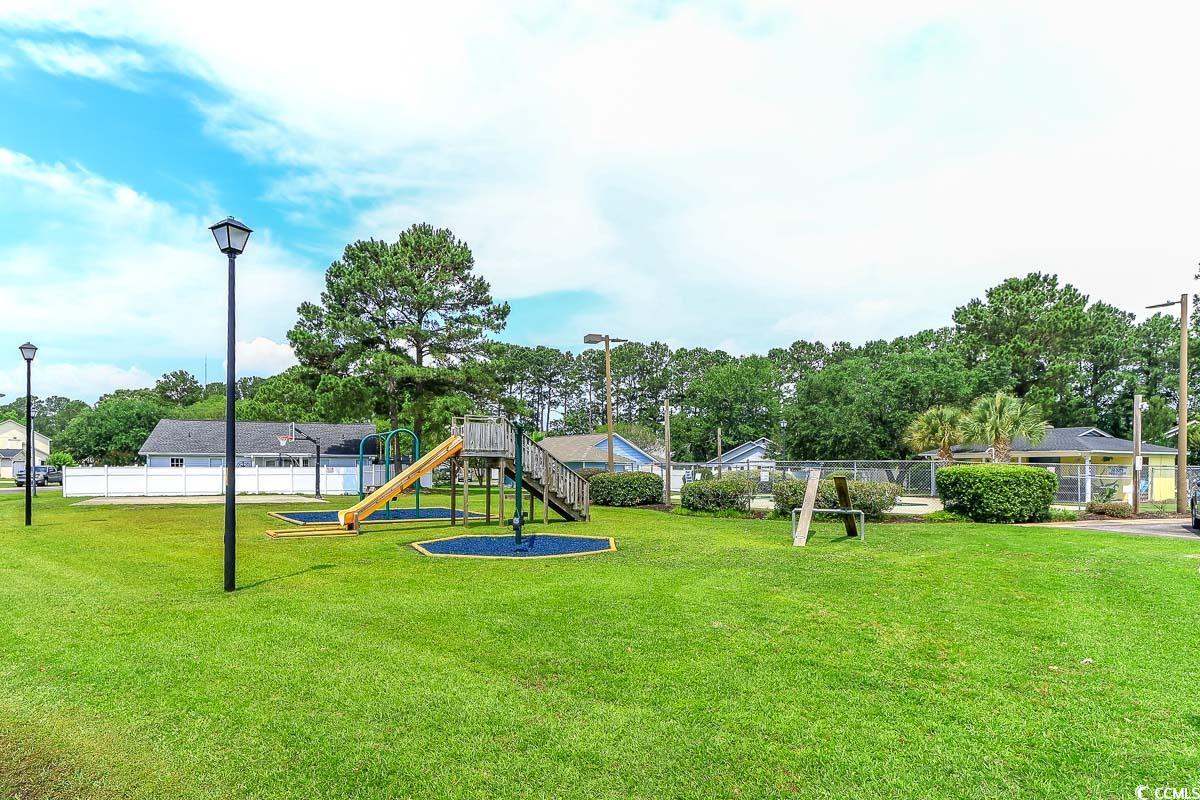 9664 Middleton Court Murrells Inlet, SC 29576 - Photo 25 of 28 View of yard with a playground and view of scatter