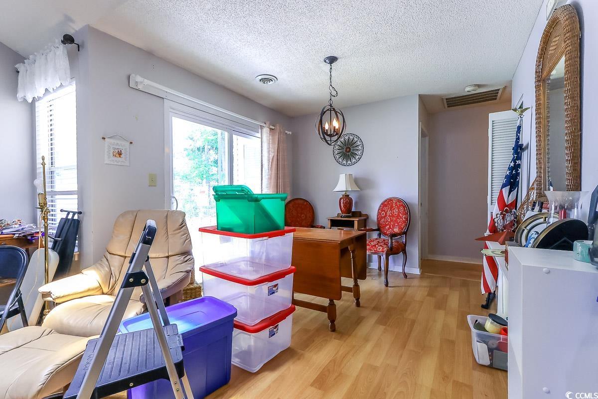 9664 Middleton Court Murrells Inlet, SC 29576 - Photo 5 of 28 Playroom with a textured ceiling, light wood-type