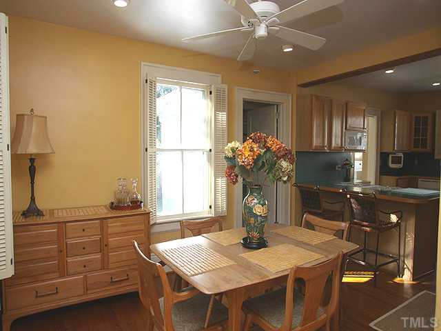 502 Harding Street Raleigh, NC 27604 - Photo 8 of 25 a kitchen with a table chairs and cabinets