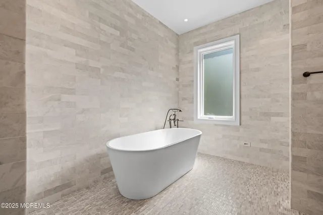 a bathroom with a double vanity sink mirror and