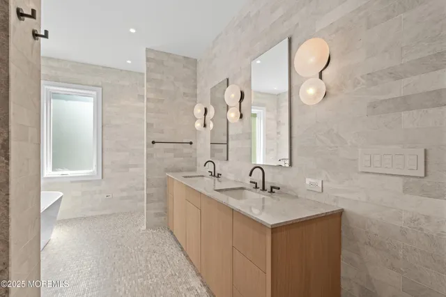 a bedroom with two beds and painting on the wall