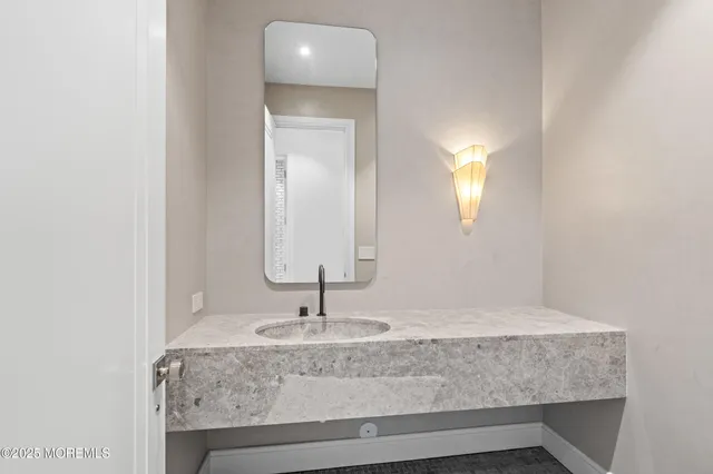 a view of a white house with a big yard