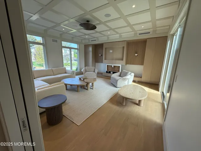 a living room with furniture and a rug