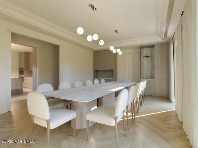a view of a a dining room with furniture and wooden floor