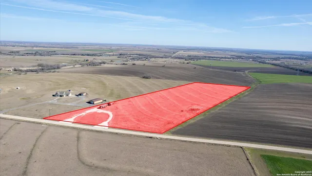 an aerial view of an ocean and beach