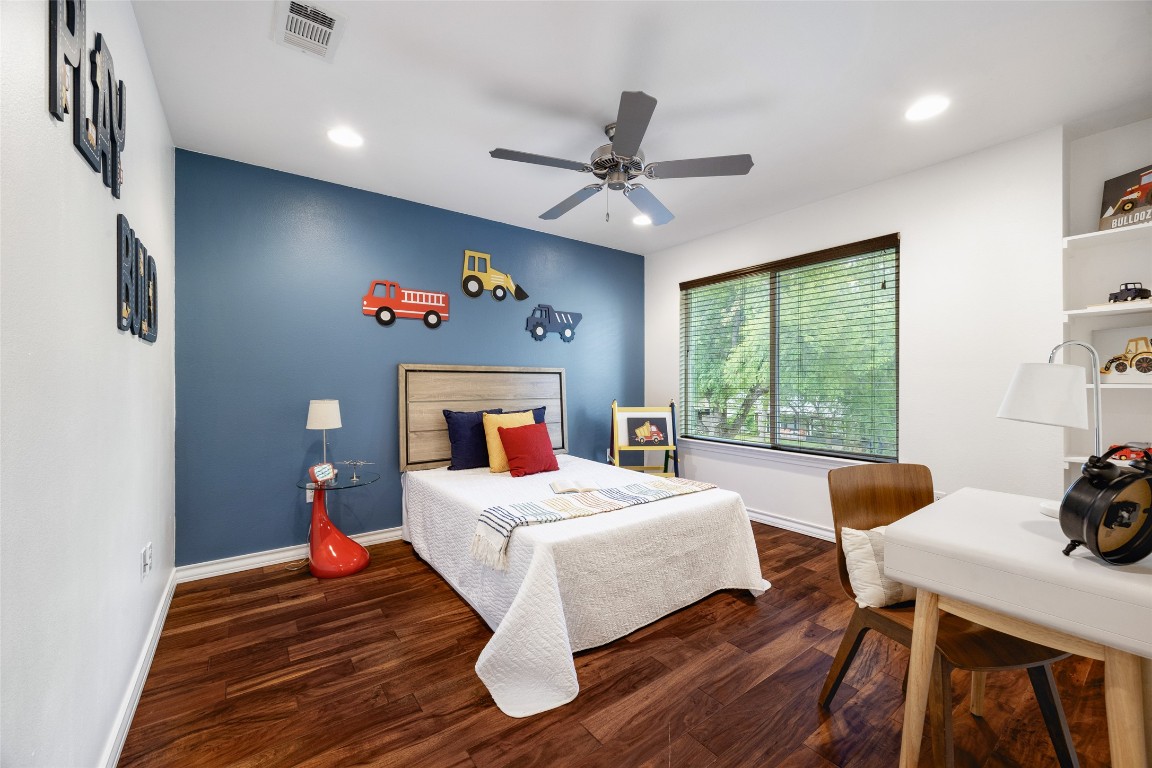 3407 Banton Road, Unit A Austin, TX 78722 - Photo 15 of 39 Bedroom with dark wood-style floors, ceiling fan, and recessed lighting