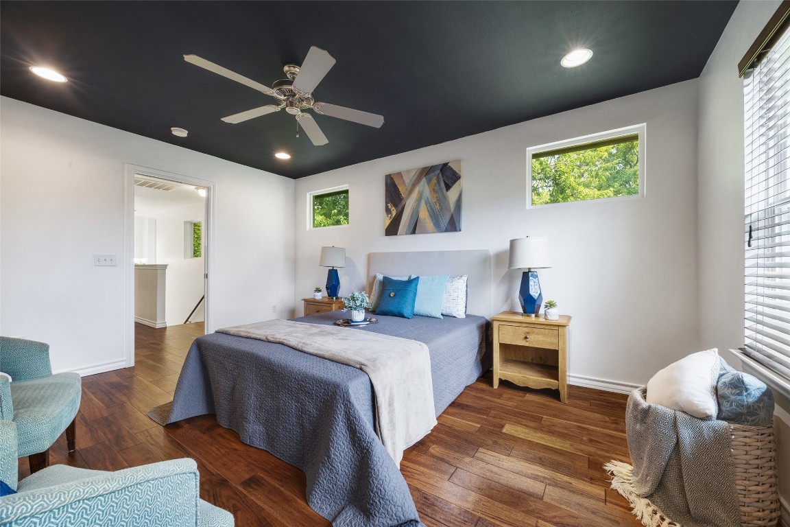 3407 Banton Road, Unit A Austin, TX 78722 - Photo 19 of 39 Bedroom with hardwood / wood-style flooring, ceiling fan, recessed lighting, and multiple windows