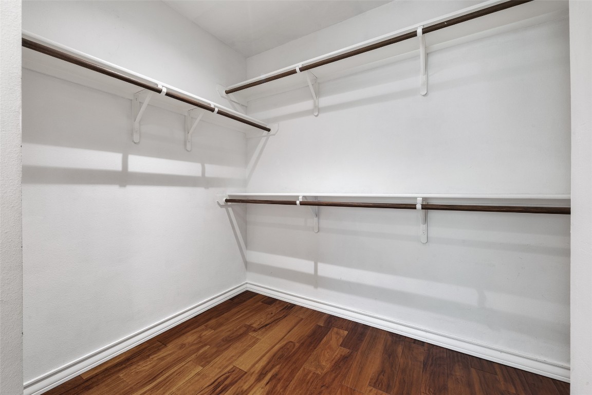 3407 Banton Road, Unit A Austin, TX 78722 - Photo 23 of 39 Walk in closet featuring dark wood-type flooring