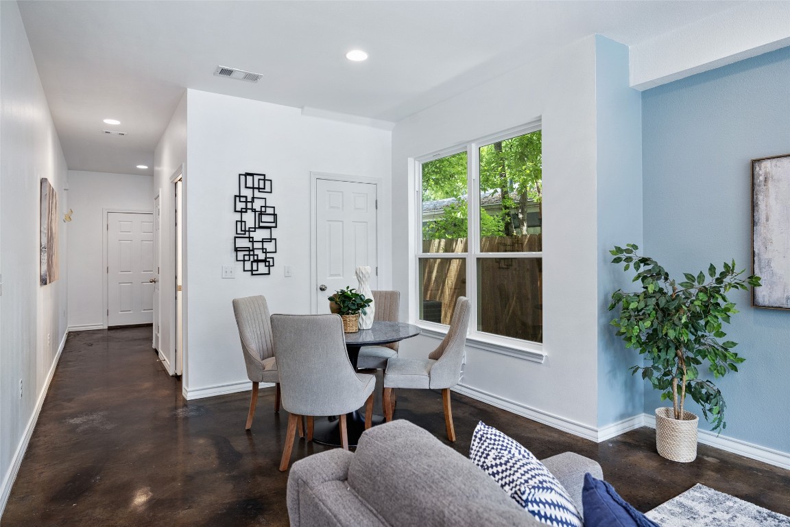 3407 Banton Road, Unit A Austin, TX 78722 - Photo 6 of 39 Dining room featuring recessed lighting and concrete flooring