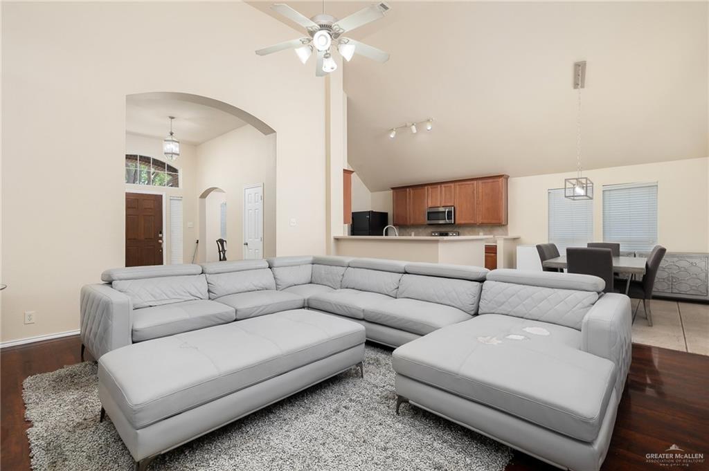 3400 San Angelo Street Mission, TX 78572 - Photo 2 of 12 a living room with furniture white walls and a chandelier