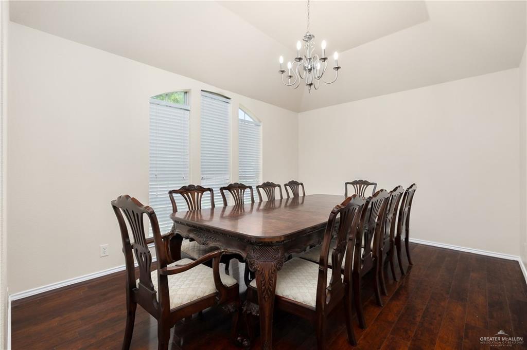 3400 San Angelo Street Mission, TX 78572 - Photo 5 of 12 a view of a dining room with furniture and wooden floor