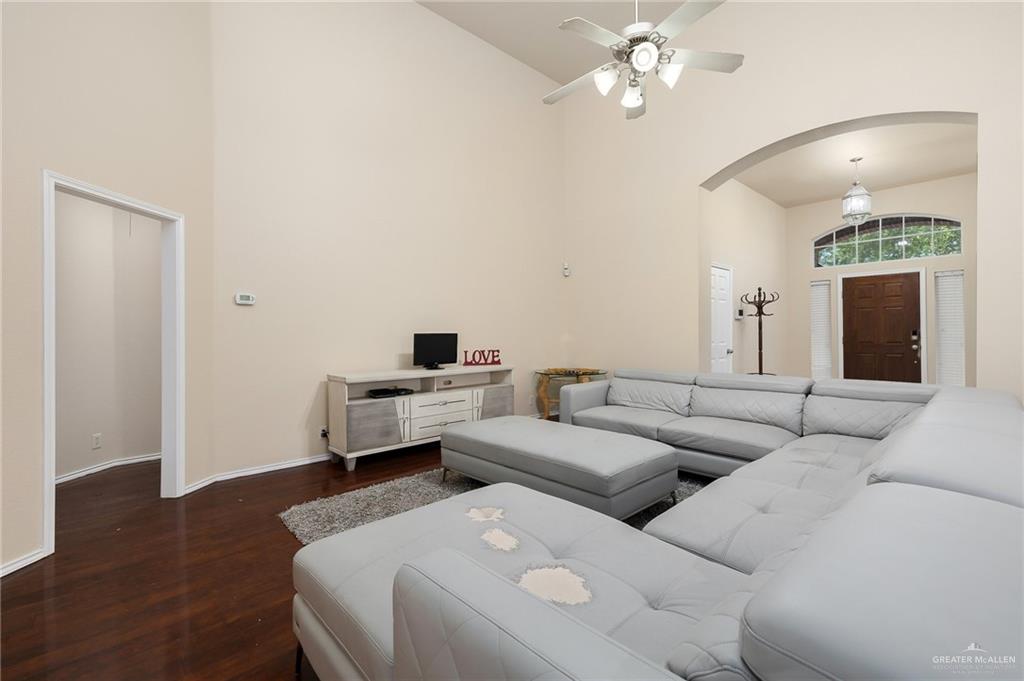 3400 San Angelo Street Mission, TX 78572 - Photo 6 of 12 a living room with furniture and a wooden floor
