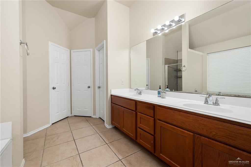 3400 San Angelo Street Mission, TX 78572 - Photo 8 of 12 a spacious bathroom with a double vanity sink mirror and double