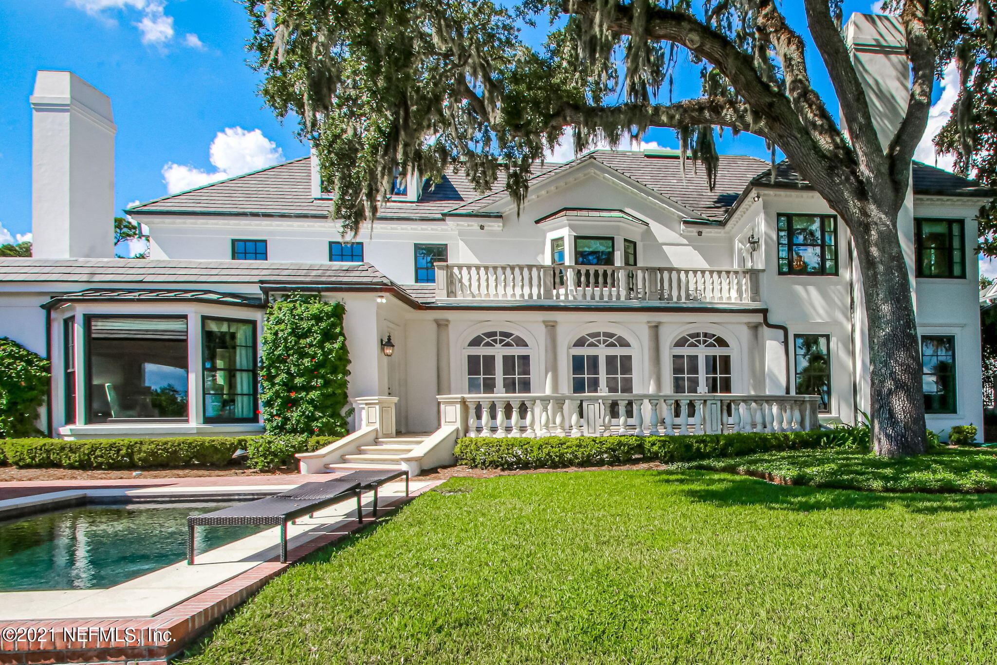 3955 Ortega Boulevard Jacksonville, FL 32210 - Photo 120 of 170 a front view of a house with a yard and potted plants