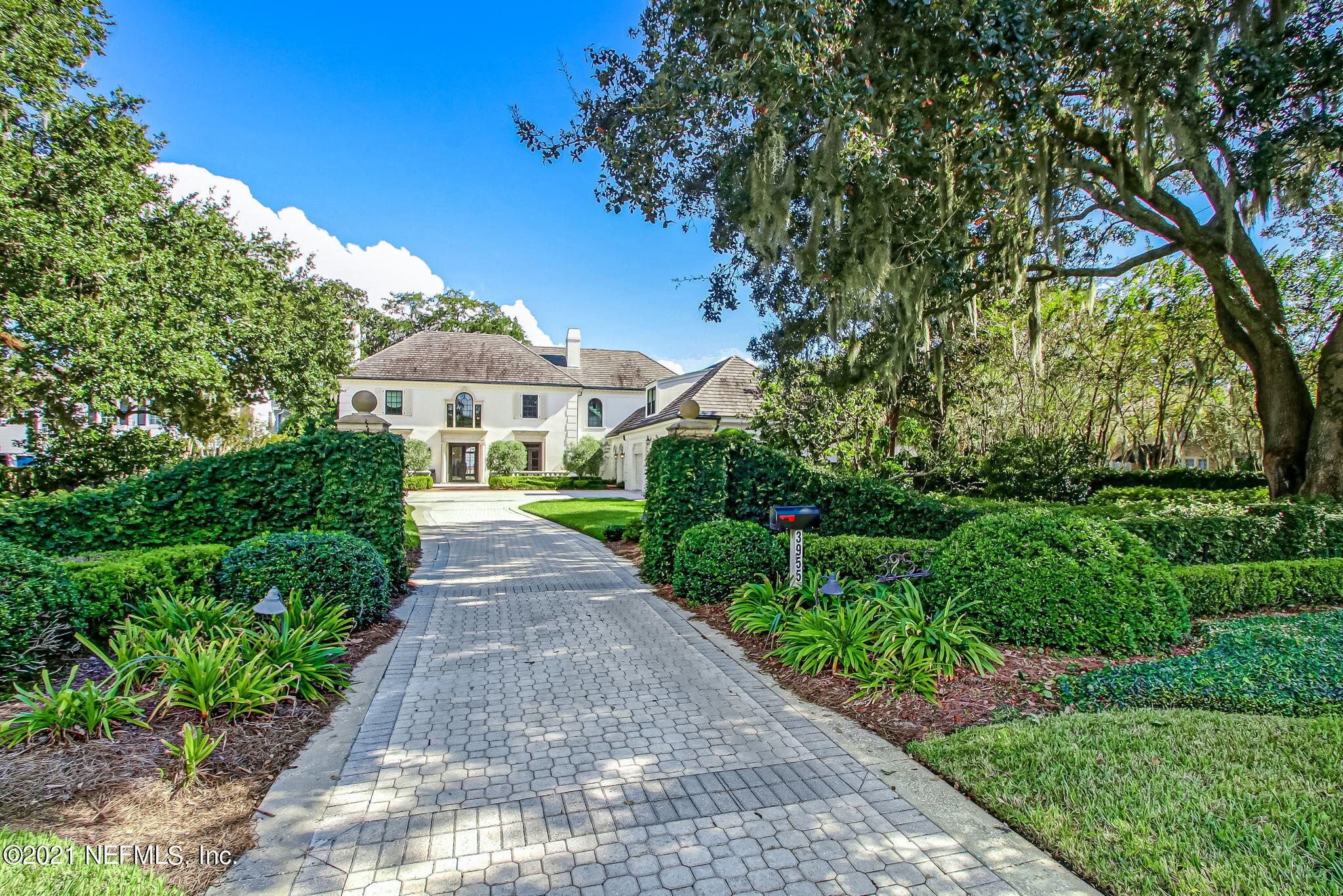 3955 Ortega Boulevard Jacksonville, FL 32210 - Photo 168 of 170 a front view of a house with a yard and fountain in middle