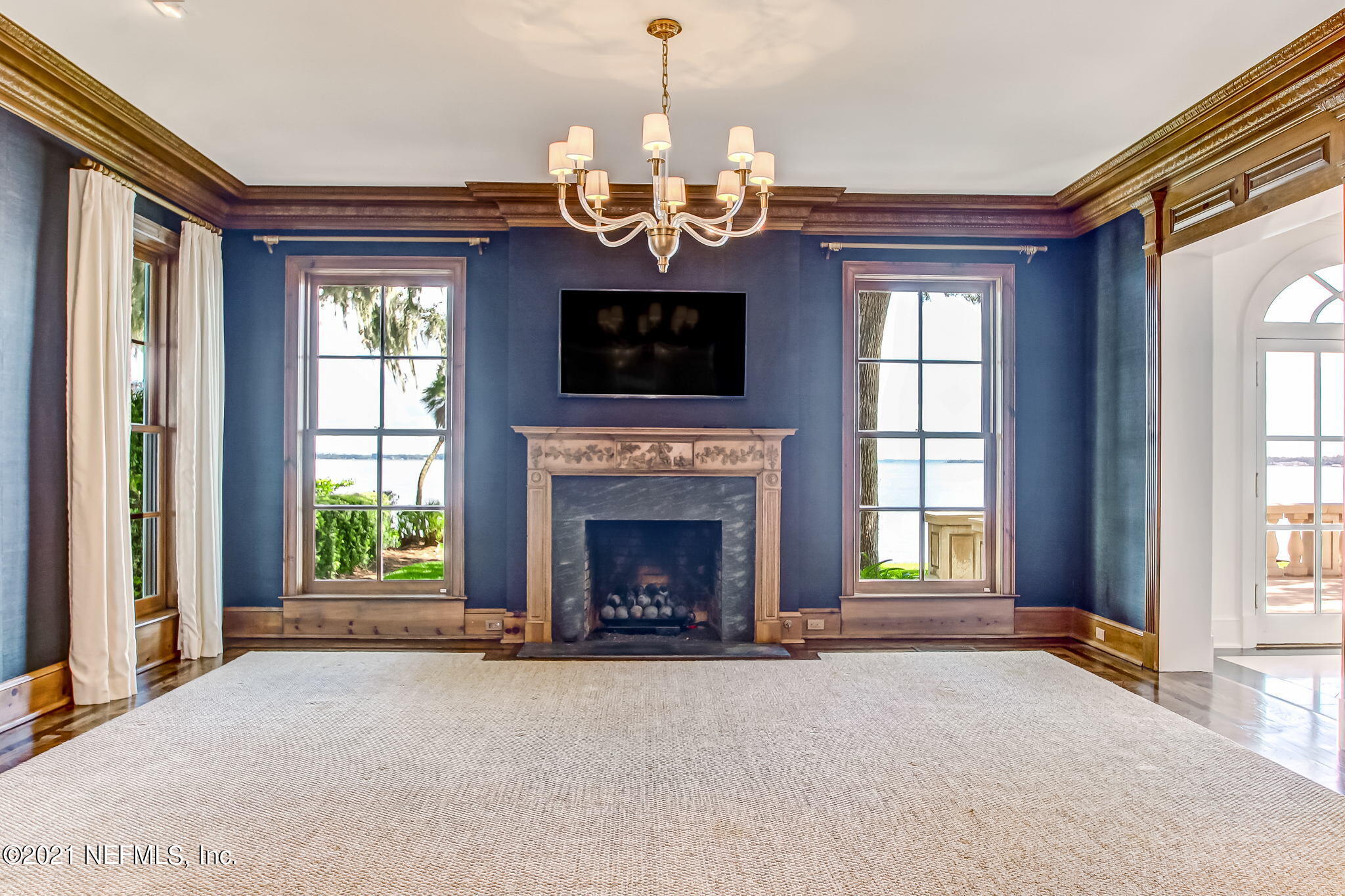 3955 Ortega Boulevard Jacksonville, FL 32210 - Photo 23 of 170 a view of a livingroom with a fireplace and large windows