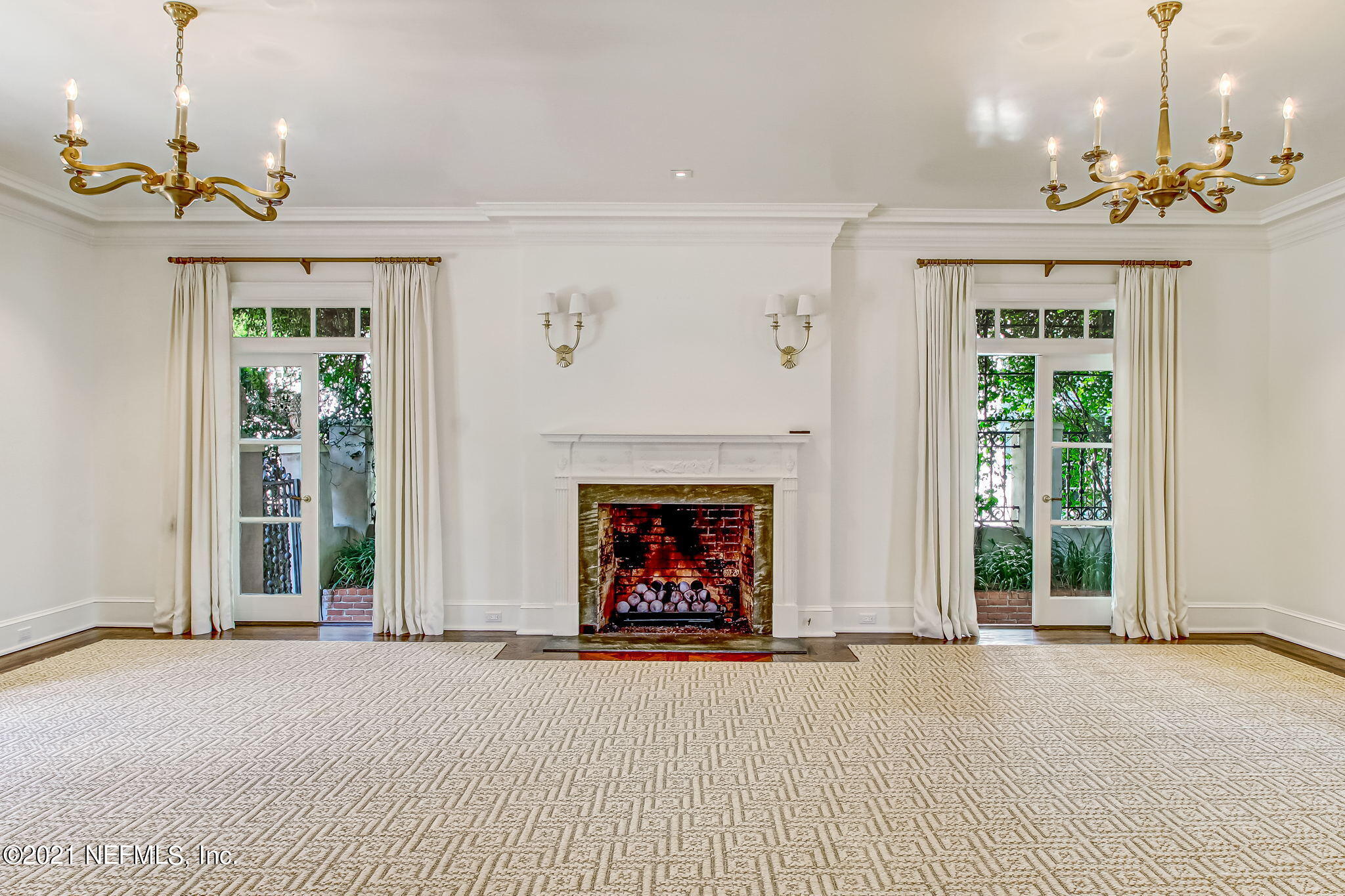 3955 Ortega Boulevard Jacksonville, FL 32210 - Photo 30 of 170 a view of an empty room with a fireplace and a chandelier