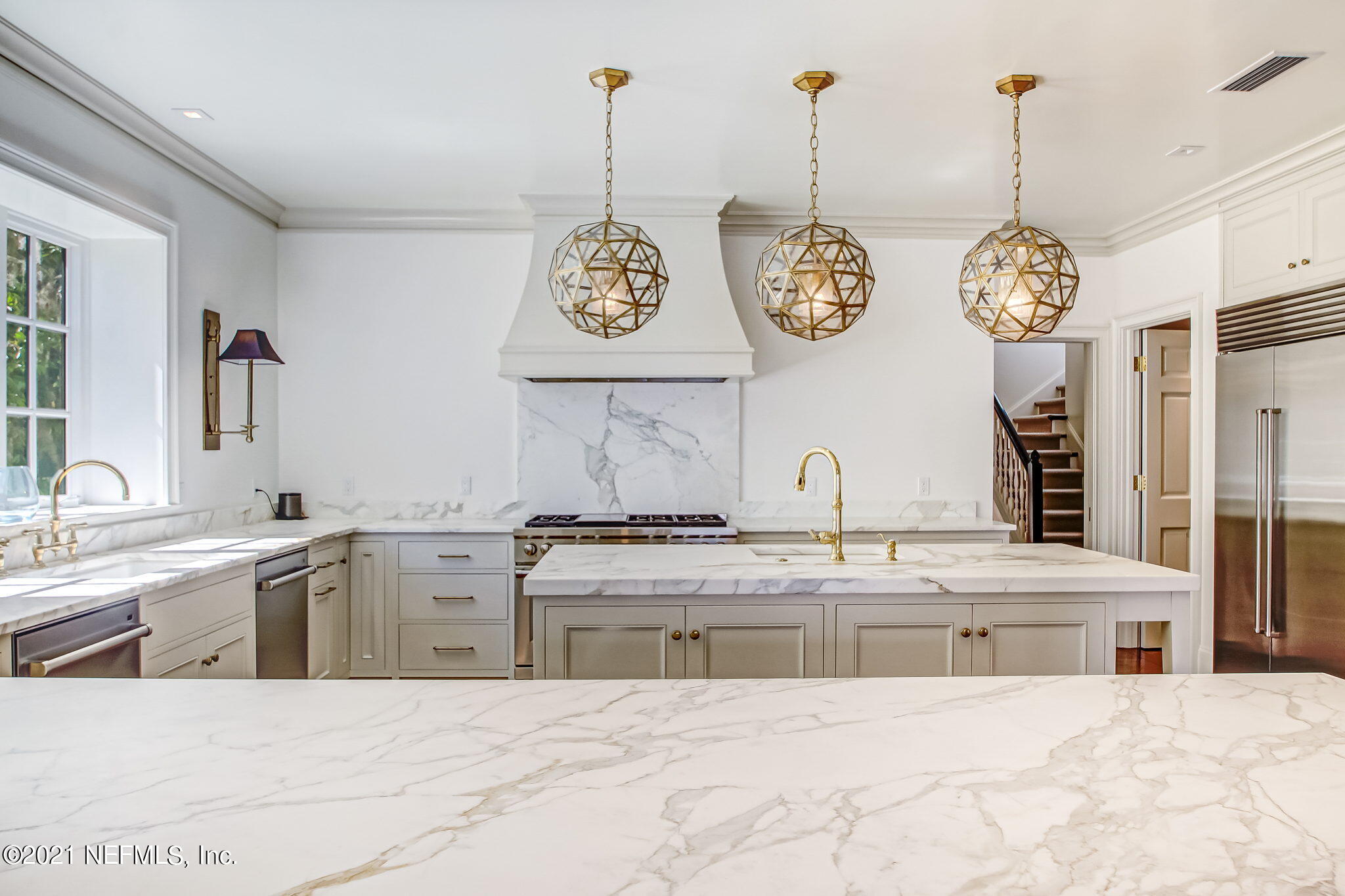 3955 Ortega Boulevard Jacksonville, FL 32210 - Photo 43 of 170 a view of a kitchen with kitchen island stainless steel appliances a stove a sink and a chandelier