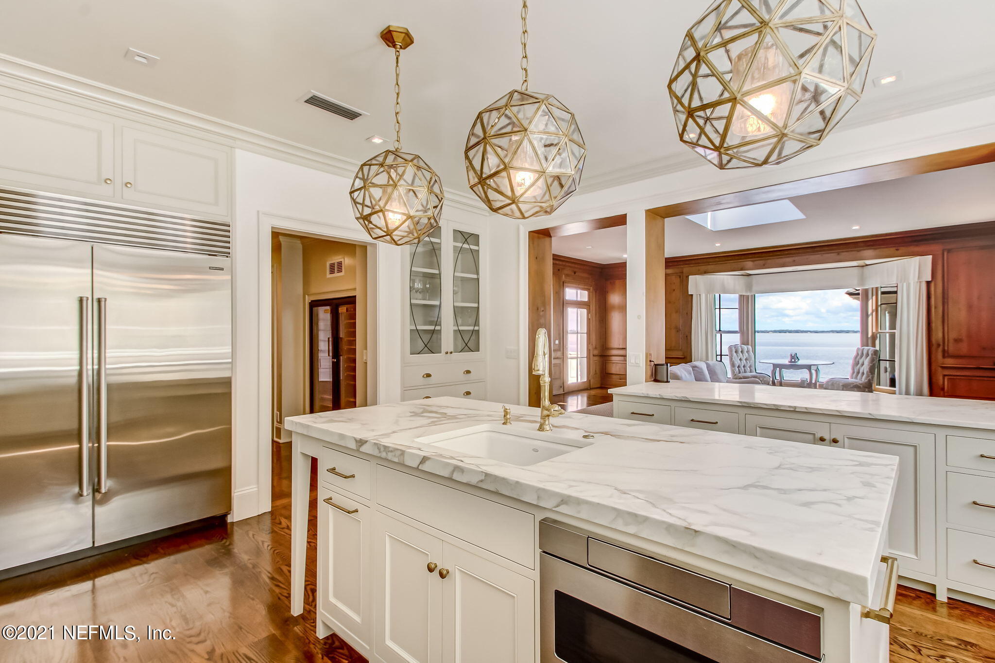 3955 Ortega Boulevard Jacksonville, FL 32210 - Photo 49 of 170 a view of a kitchen island with a large window wooden floor and a kitchen view