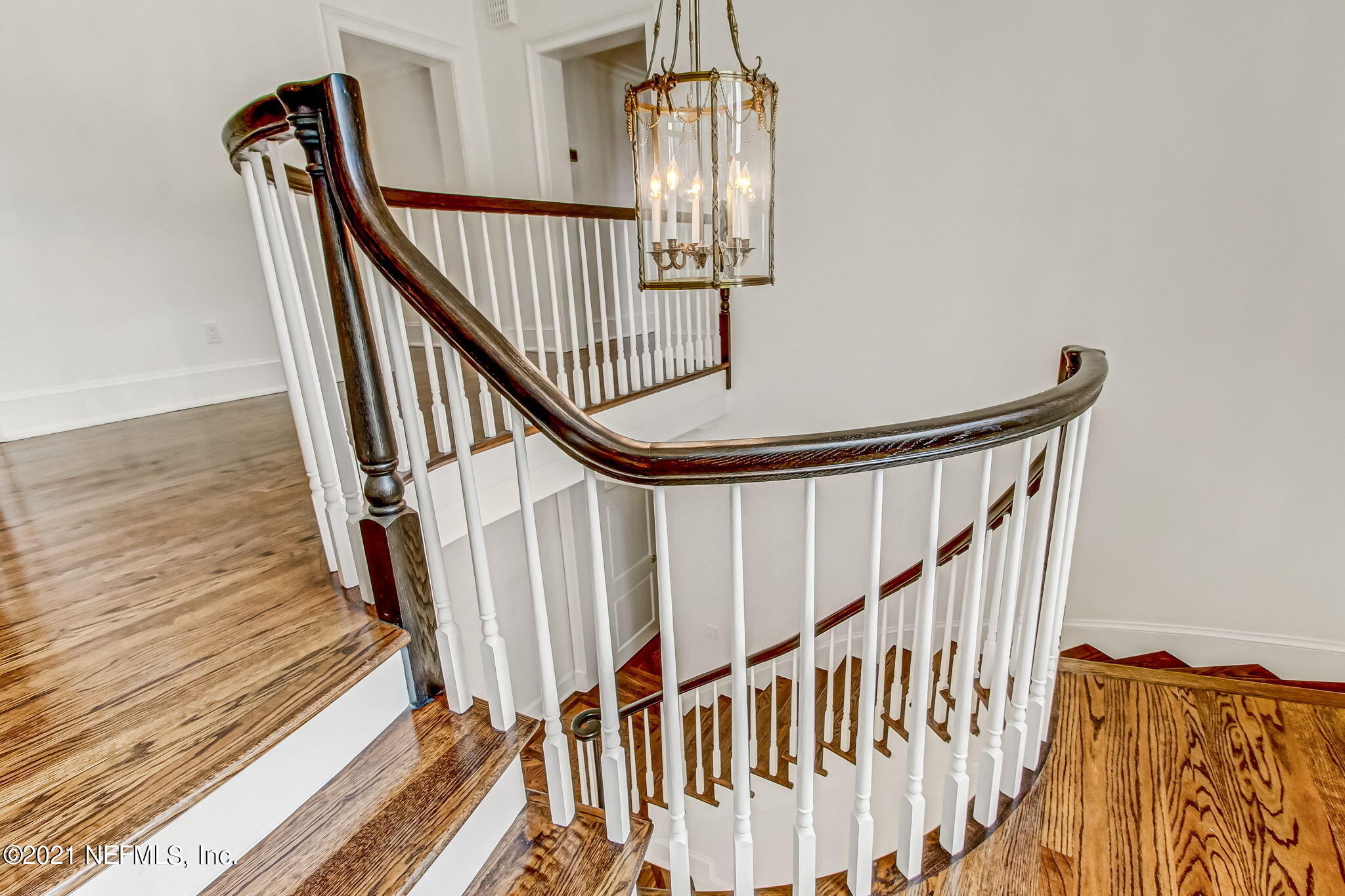3955 Ortega Boulevard Jacksonville, FL 32210 - Photo 61 of 170 a view of staircase with wooden floor and white walls