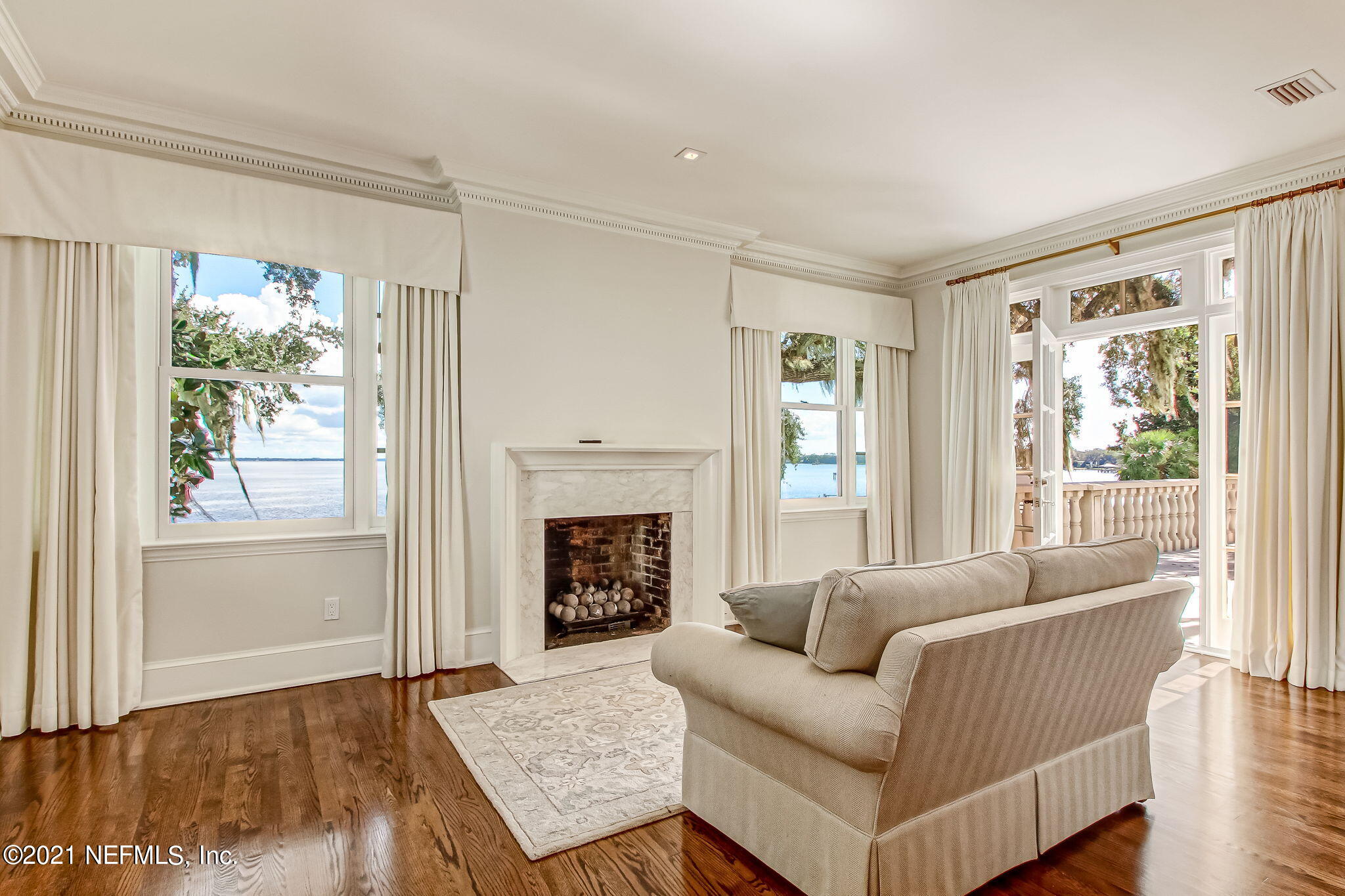 3955 Ortega Boulevard Jacksonville, FL 32210 - Photo 66 of 170 a living room with furniture and a fireplace