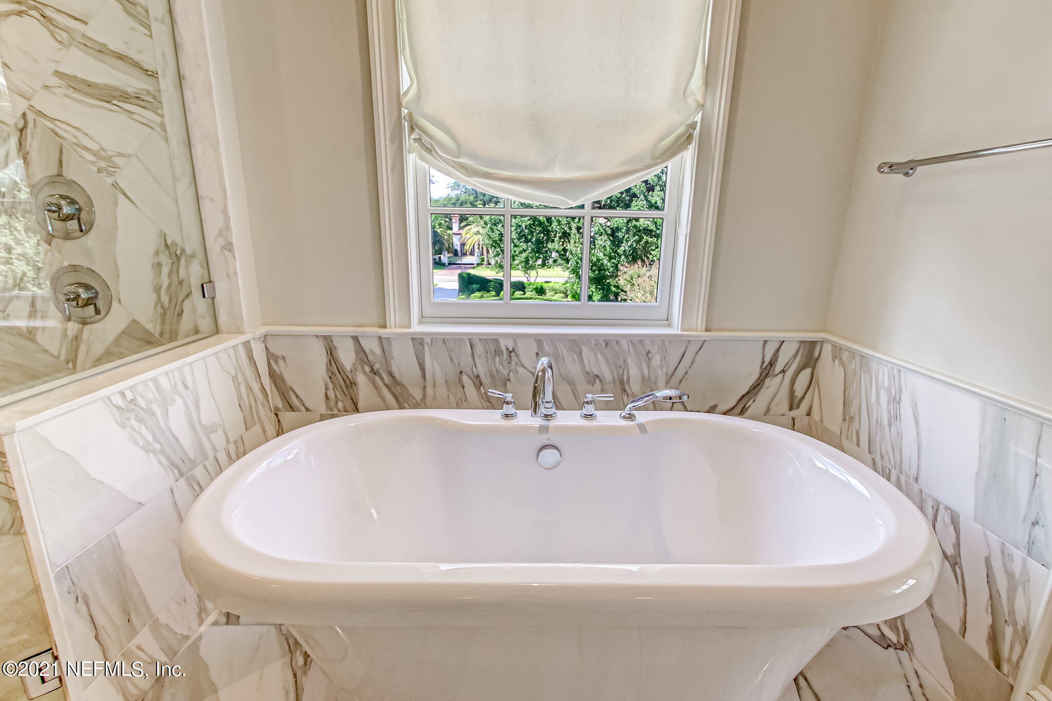 3955 Ortega Boulevard Jacksonville, FL 32210 - Photo 72 of 170 a white bath tub sitting in a bathroom