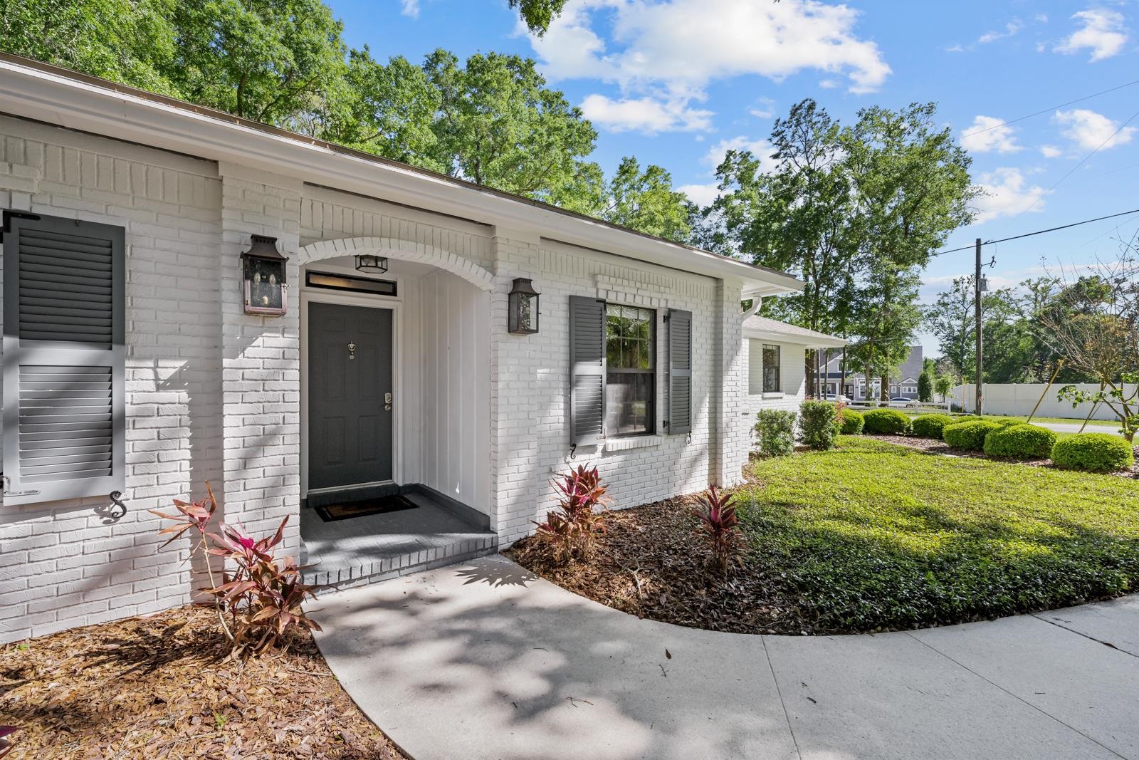 3911 Hillwood Road Jacksonville, FL 32223 - Photo 3 of 33 Doorway to property with a lawn