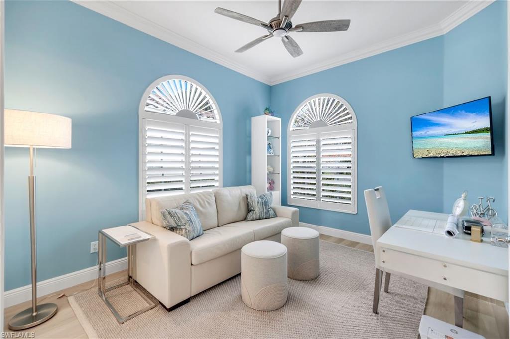 3787 Whidbey Way Naples, FL 34119 - Photo 11 of 50 a living room with furniture and a large window