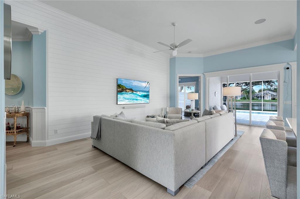 3787 Whidbey Way Naples, FL 34119 - Photo 12 of 50 a view of living room with furniture and a wooden floor