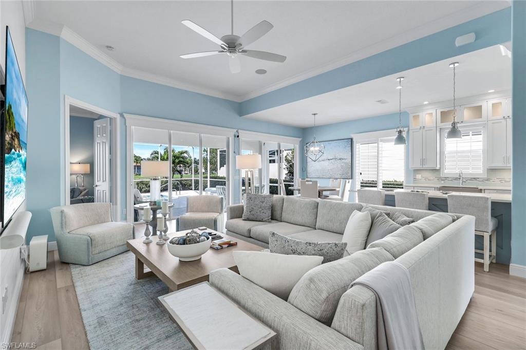 3787 Whidbey Way Naples, FL 34119 - Photo 14 of 50 a living room with furniture and a large window