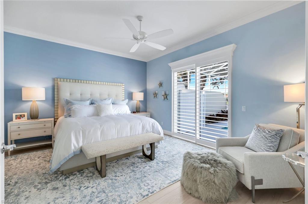 3787 Whidbey Way Naples, FL 34119 - Photo 19 of 50 a bedroom with a bed and a couch