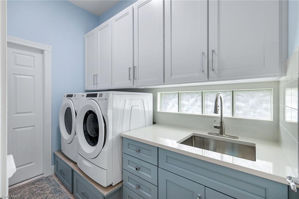 3787 Whidbey Way Naples, FL 34119 - Photo 26 of 50 a kitchen with sink and cabinets