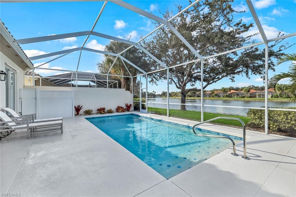 3787 Whidbey Way Naples, FL 34119 - Photo 29 of 50 a view of a backyard with swimming pool