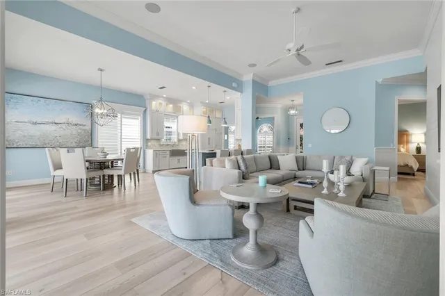 a living room with furniture and a mirror