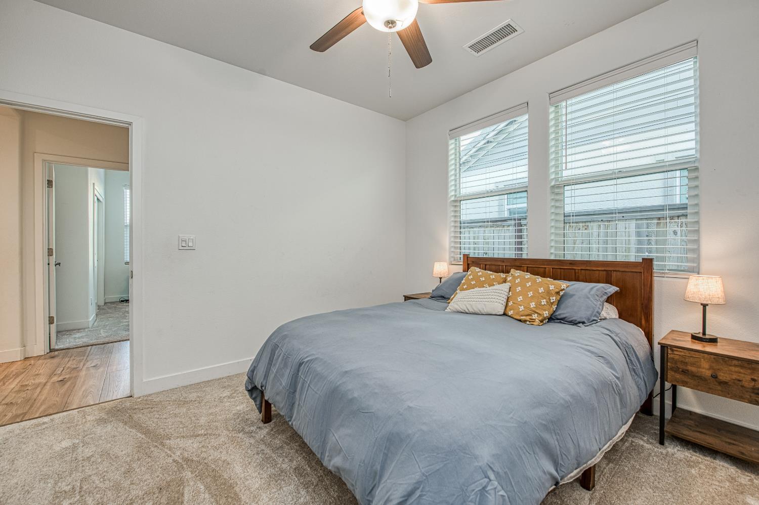 4534 Hillside Road Madera, CA 93636 - Photo 19 of 92 a bedroom with a bed and a large window
