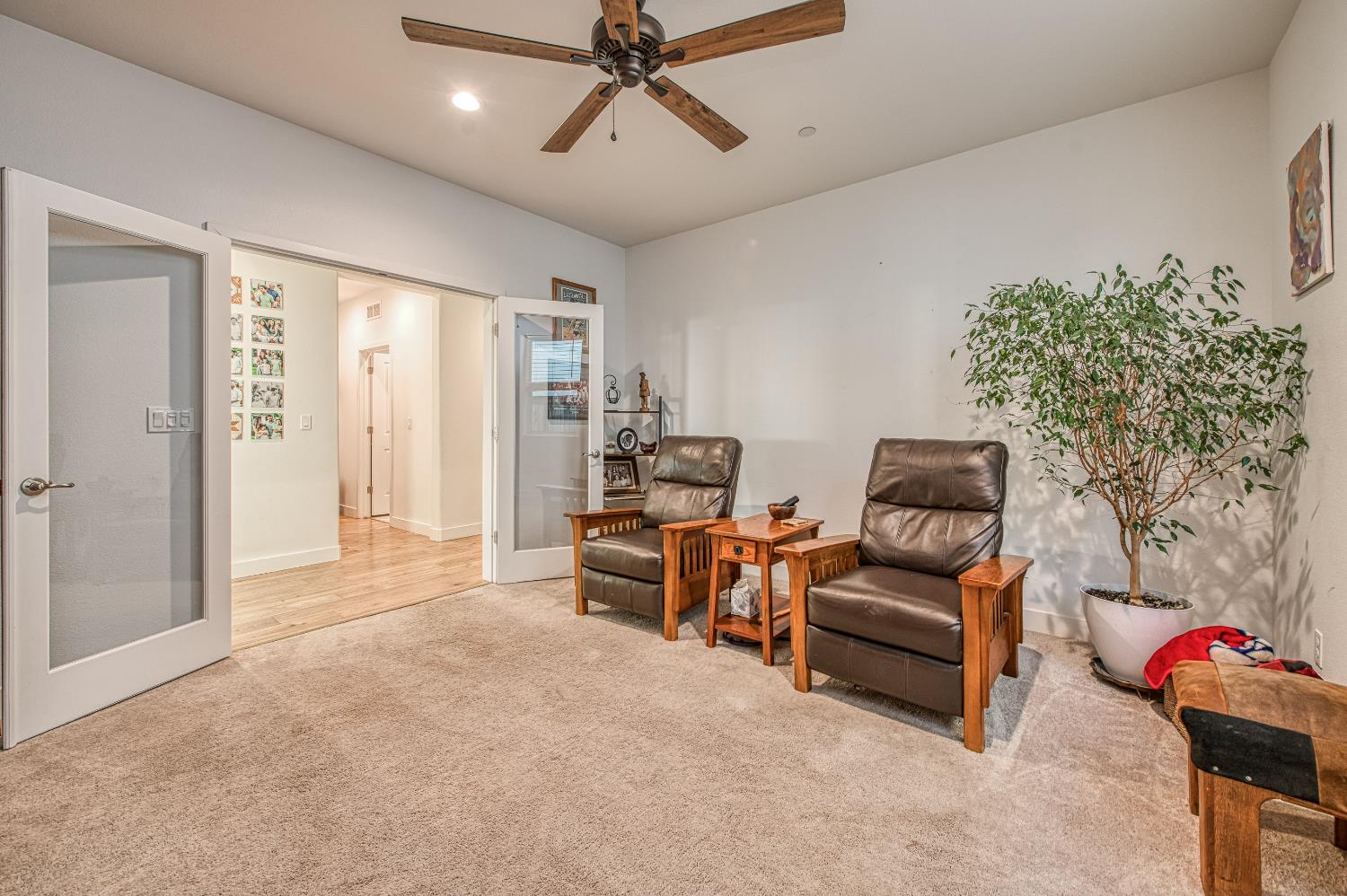 4534 Hillside Road Madera, CA 93636 - Photo 23 of 92 a living room with furniture and a chandelier