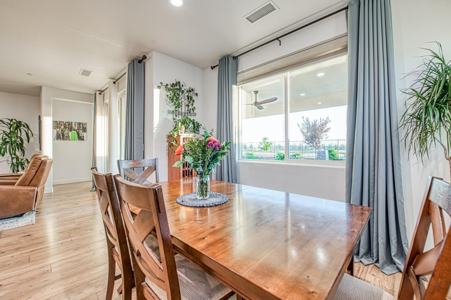 4534 Hillside Road Madera, CA 93636 - Photo 38 of 92 a dining room with furniture and wooden floor