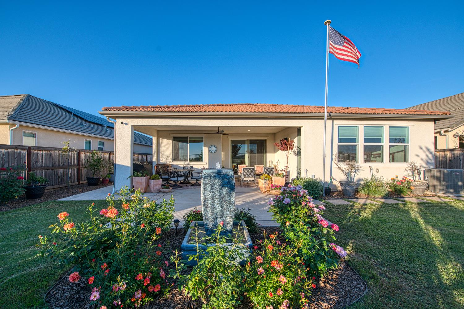 4534 Hillside Road Madera, CA 93636 - Photo 4 of 92 a view of a house with backyard sitting area and garden